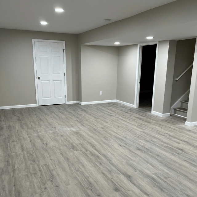 Finished basement with vinyl plank flooring